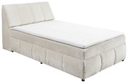Beiges Boxspringbett mit gepolstertem Kopfteil, seitliche Perspektive