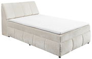 Beiges Boxspringbett mit gepolstertem Kopfteil, seitliche Perspektive
