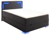 Boxspringbett mit schwarzem Bezug und blauer LED-Beleuchtung, seitliche Perspektive