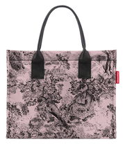 Vorderansicht einer eleganten Einkaufstasche mit schwarzem Griff und einem kunstvollen, schwarz-weißen Naturmotiv auf rosa Hintergrund.