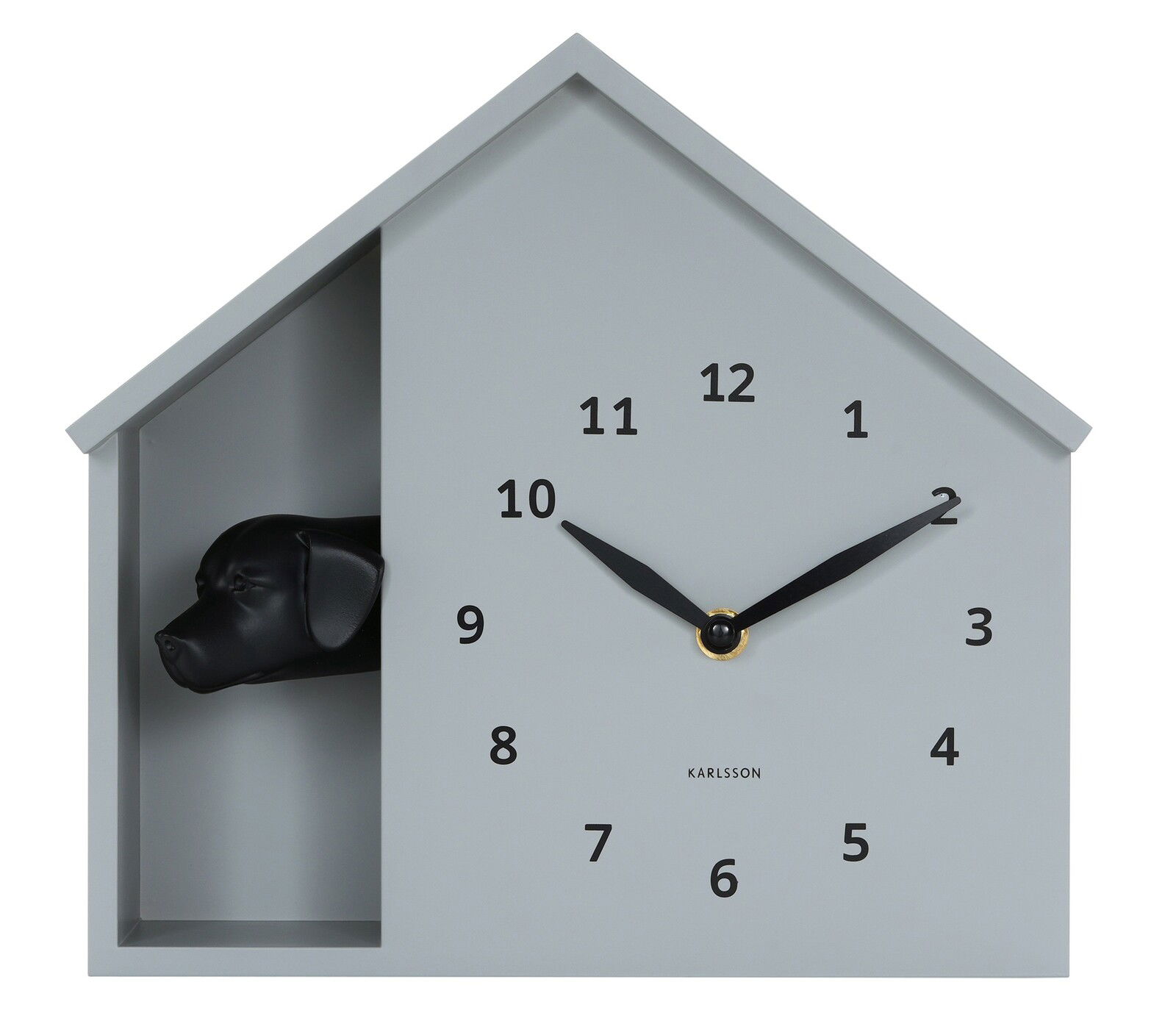 Moderne Wanduhr in Hausform mit schwarzem Hundekopf, frontal abgebildet.