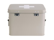 Beige Aufbewahrungsbox mit weißem Kreuz auf dem Deckel, frontal fotografiert.