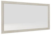 Rechteckiger Wandspiegel mit hellem Holzrahmen, seitliche Perspektive
