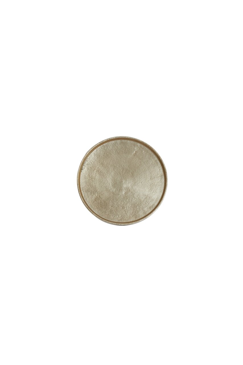 Runde, beige Schale aus der Vogelperspektive