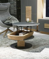 Moderner Couchtisch mit runder, grauer Tischplatte und Holzdetails, seitliche Perspektive