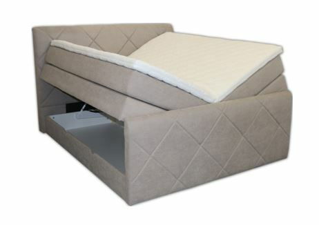 Boxspringbett SILVIA in seitlicher Perspektive mit geöffnetem Bettkasten und beigem Polsterbezug