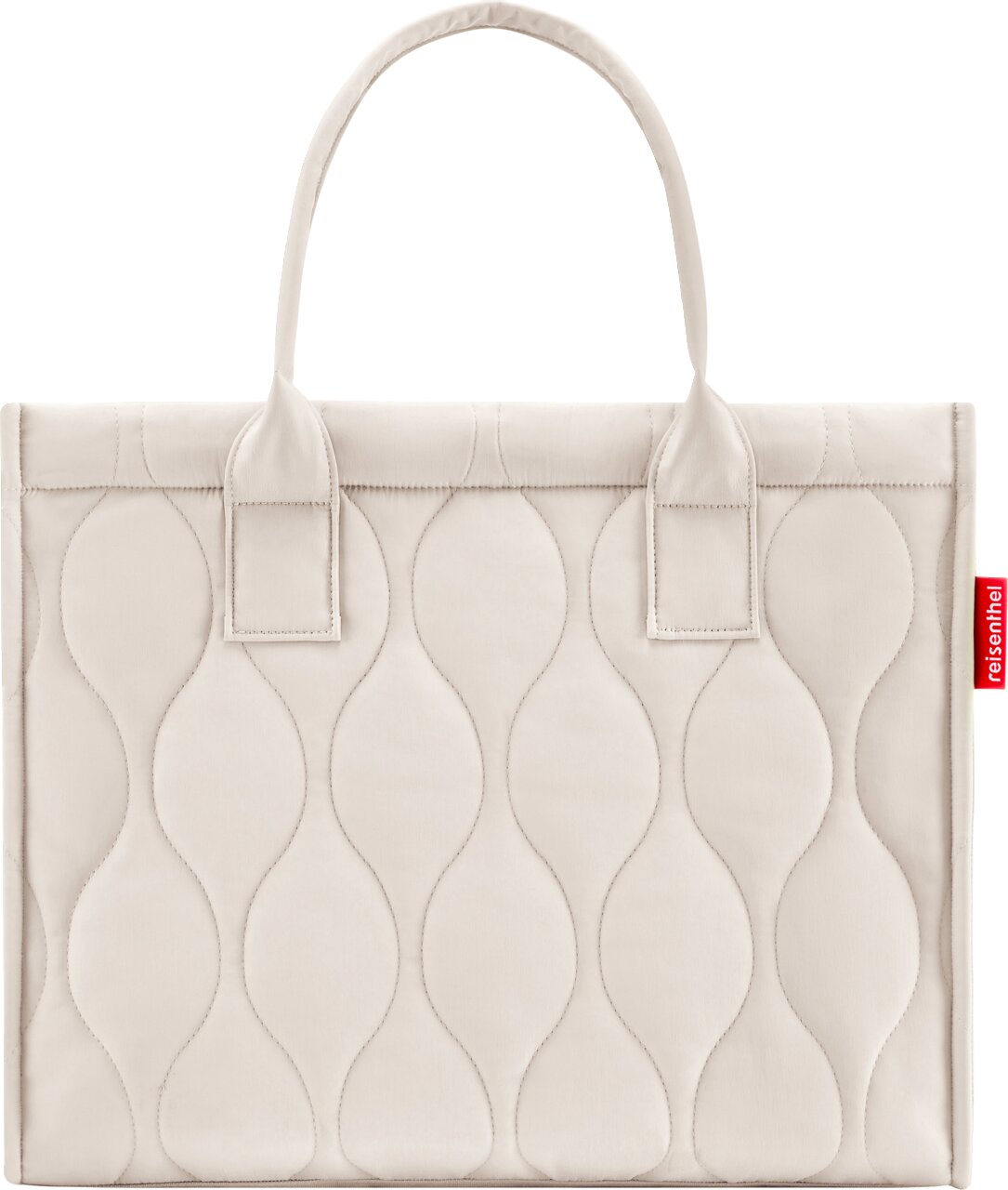 Beige gewatteerde draagtas met ovaal quiltpatroon en twee hengsels, close-up van de voorkant tegen een witte achtergrond