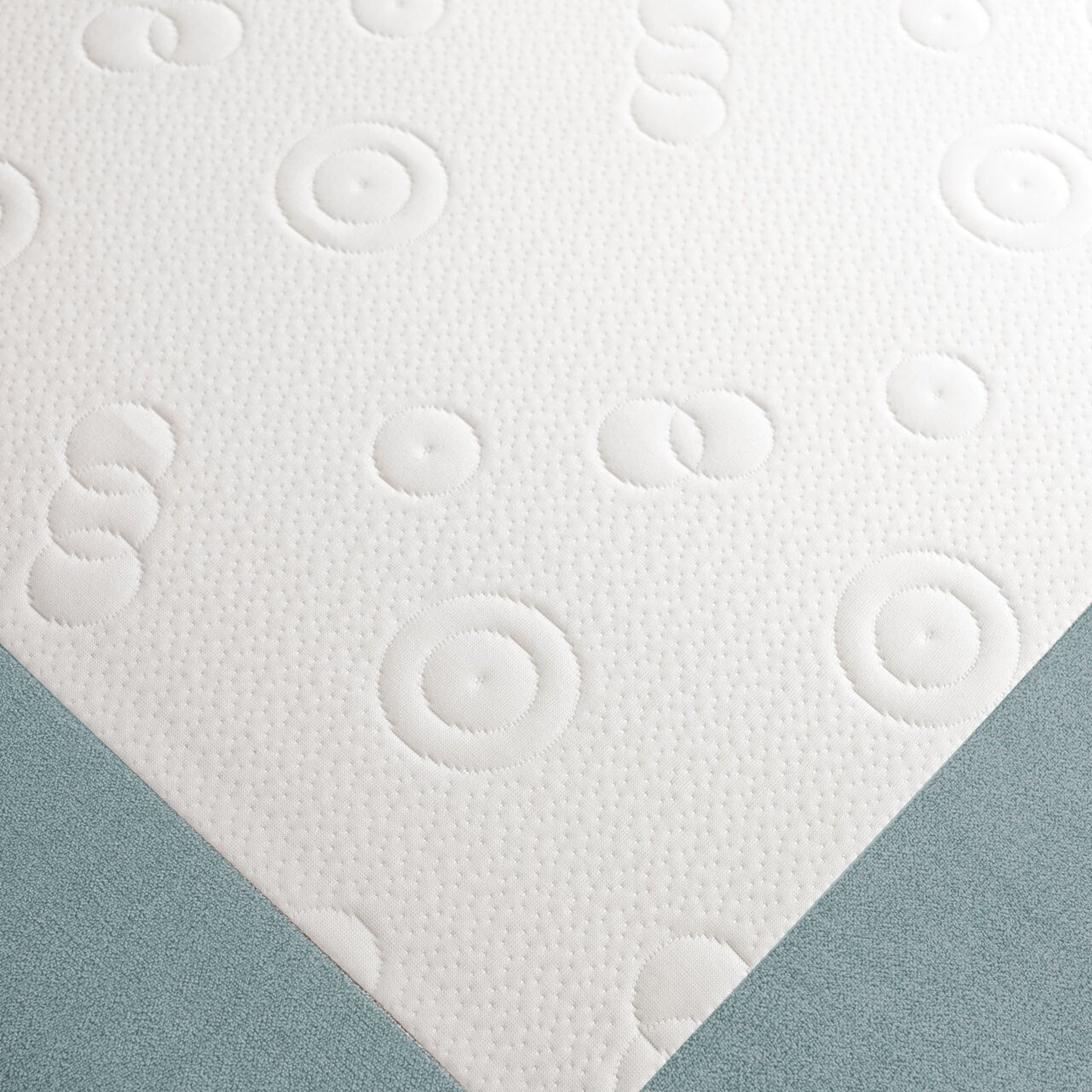 Nahaufnahme eines Funktionssofas mit weißem, gemustertem Stoff und blauer Polsterung, von oben betrachtet.