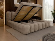 Een boxspring met opklapbaar matras, gezien vanaf de zijkant, modern design in een stijlvolle slaapkamer.