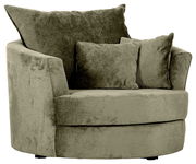 Grüner Sessel mit runder Form und zwei Kissen, seitliche Perspektive