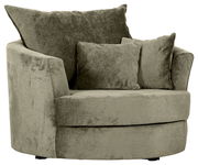 Grüner Sessel mit runder Form und zwei Kissen, seitliche Perspektive