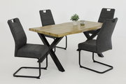 Esszimmer mit einem Holztisch und vier modernen Schwingstühlen in dunklem Grau, seitliche Perspektive
