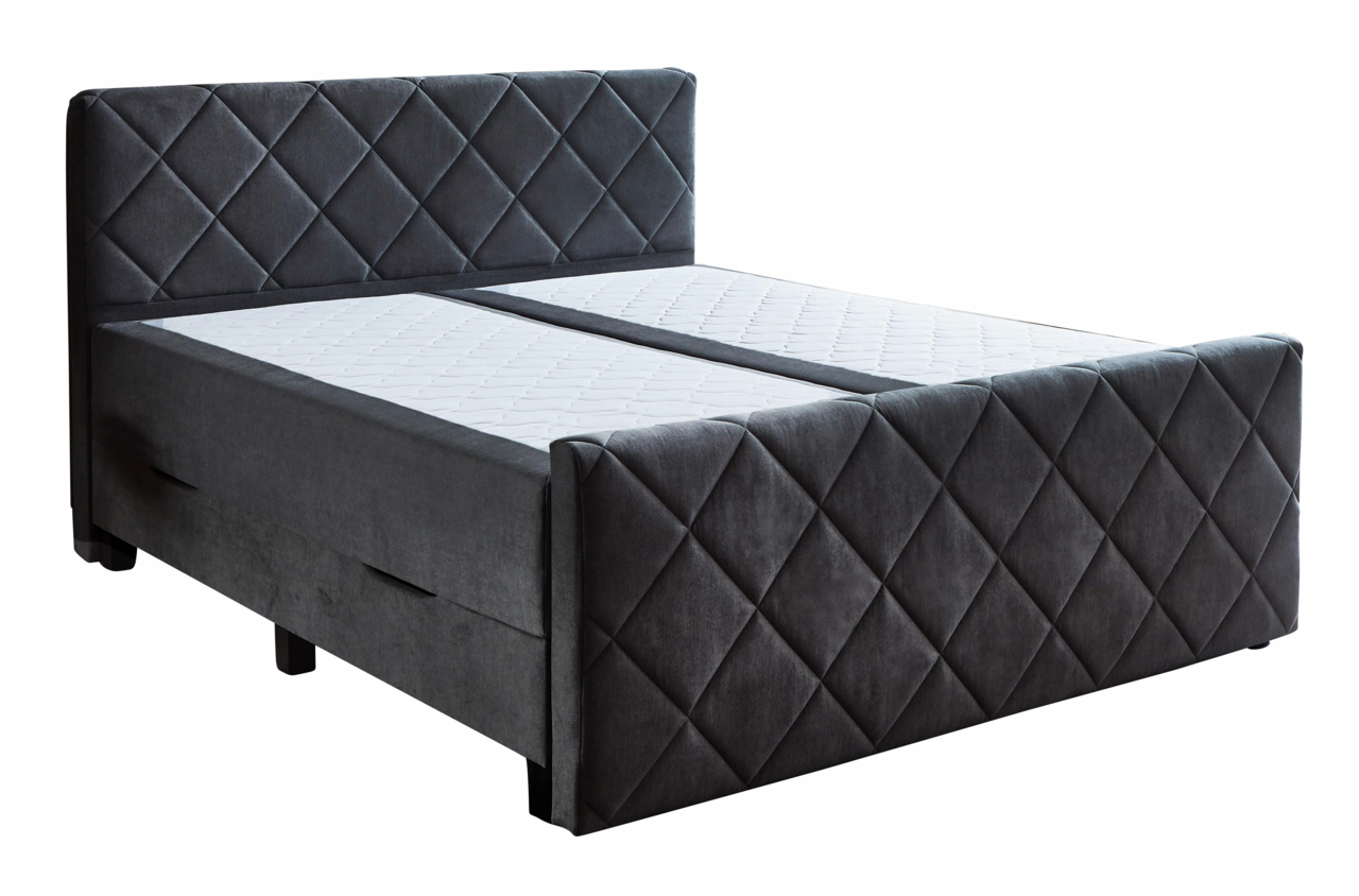Boxspringbett in dunklem Stoff mit gestepptem Kopf- und Fußteil, seitliche Perspektive