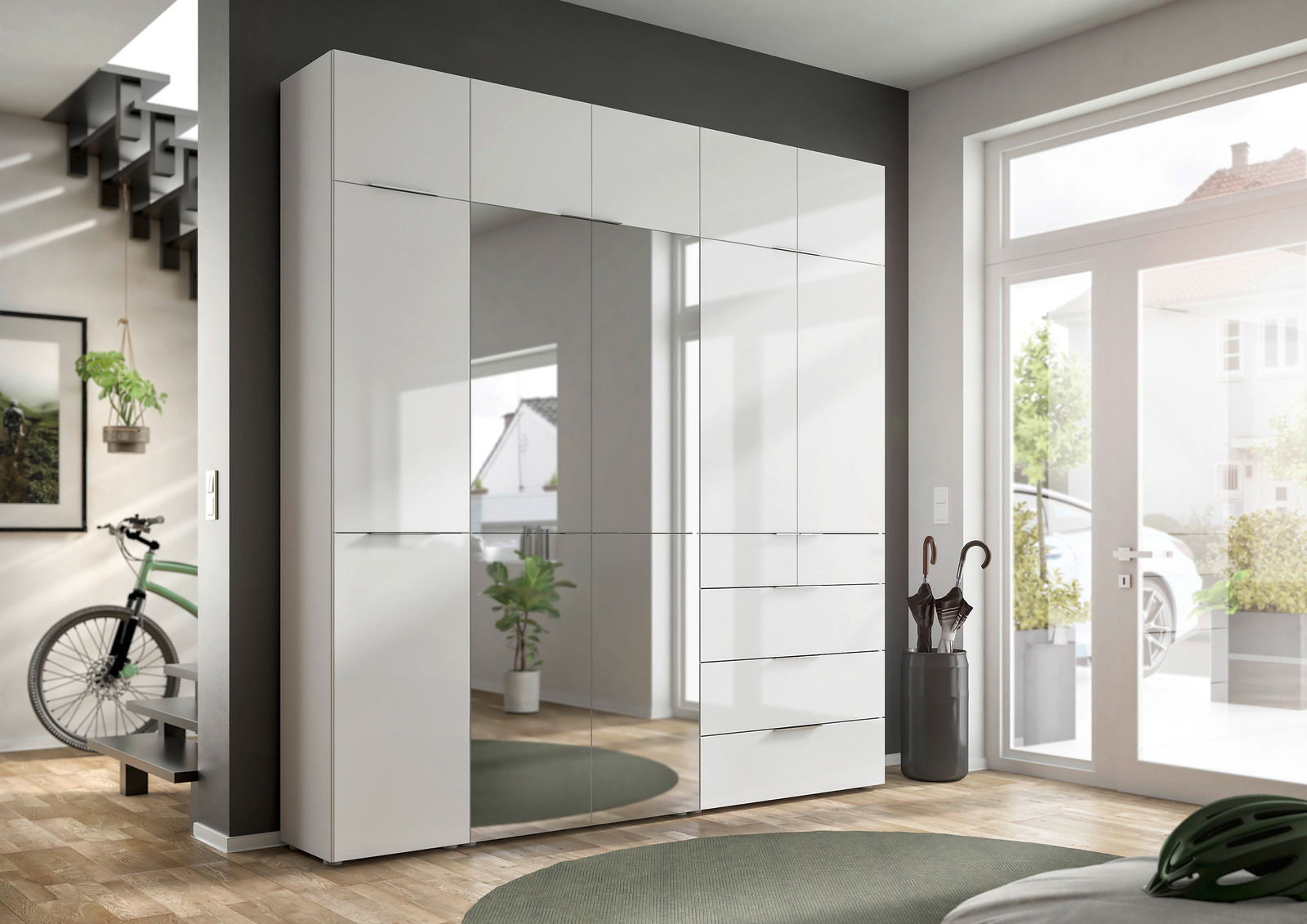 Novel Aufsatz 45cm FOCUS Moderner weißer Kleiderschrank mit Spiegeltüren und Schubladen, perspektivisch von vorne rechts fotografiert, in einem hellen Raum mit großen Fenstern.