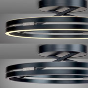 Moderne Deckenleuchte PURE Loop von Paul Neuhaus in schwarzem Metall mit zwei leuchtenden Ringen, seitliche Perspektive.