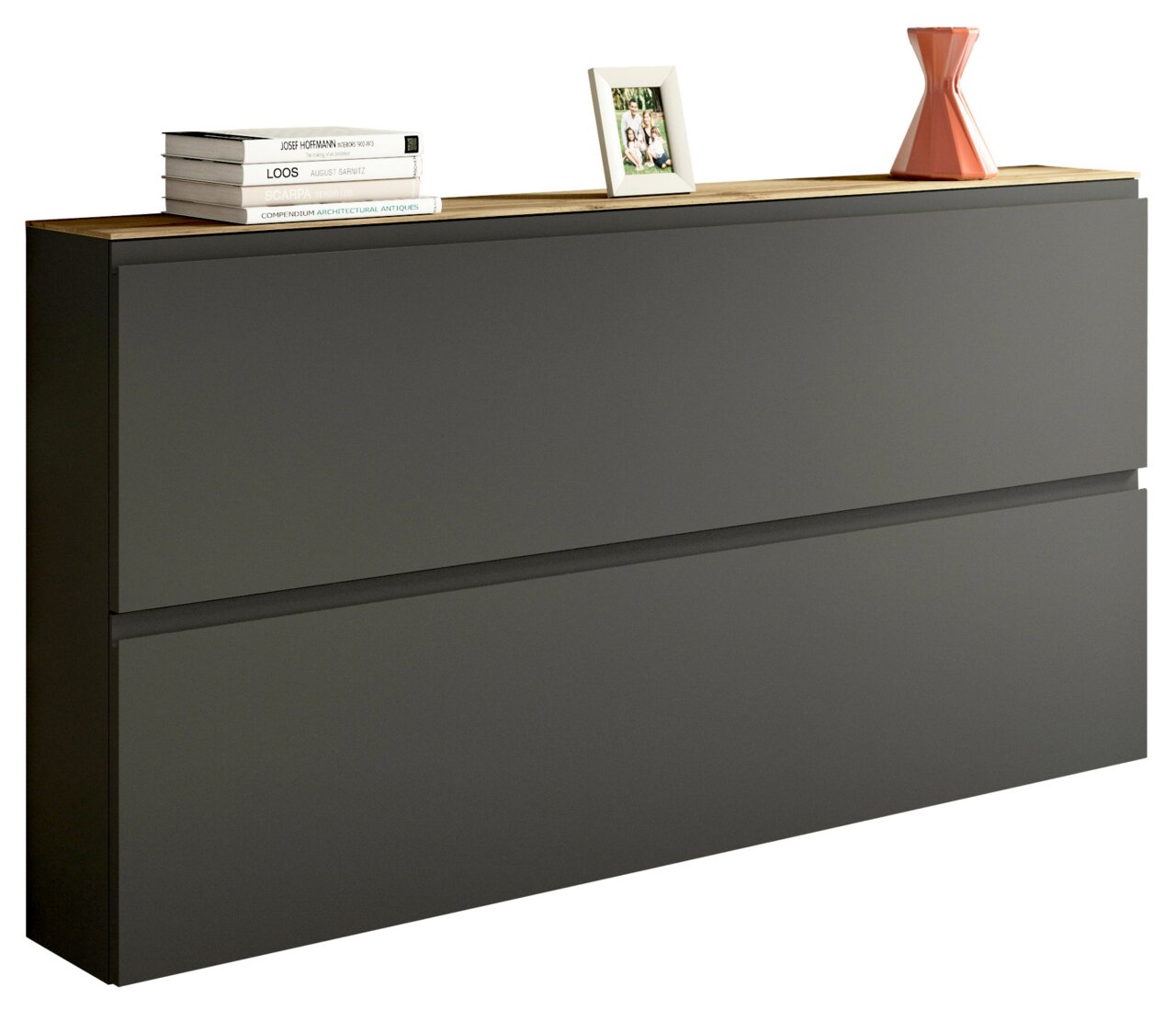 Moderner XL-Hängeschuhschrank in dunklem Grau mit zwei Klappen, dekoriert mit Büchern, einem Bilderrahmen und einer Vase, seitliche Perspektive.
