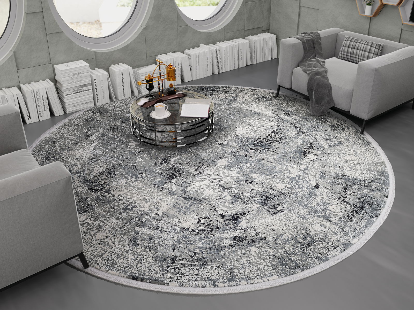 Runder Designer Teppich in einem modernen Wohnzimmer mit grauen Sofas und einem runden Couchtisch, von oben betrachtet.