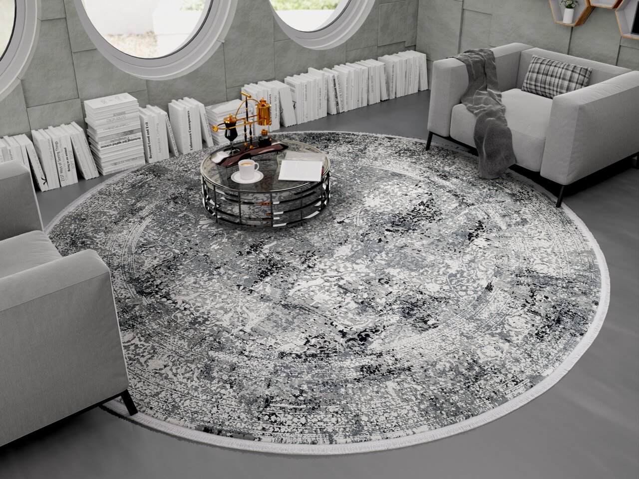 Runder Designer Teppich in einem modernen Wohnzimmer mit grauen Sofas und einem runden Couchtisch, von oben betrachtet.