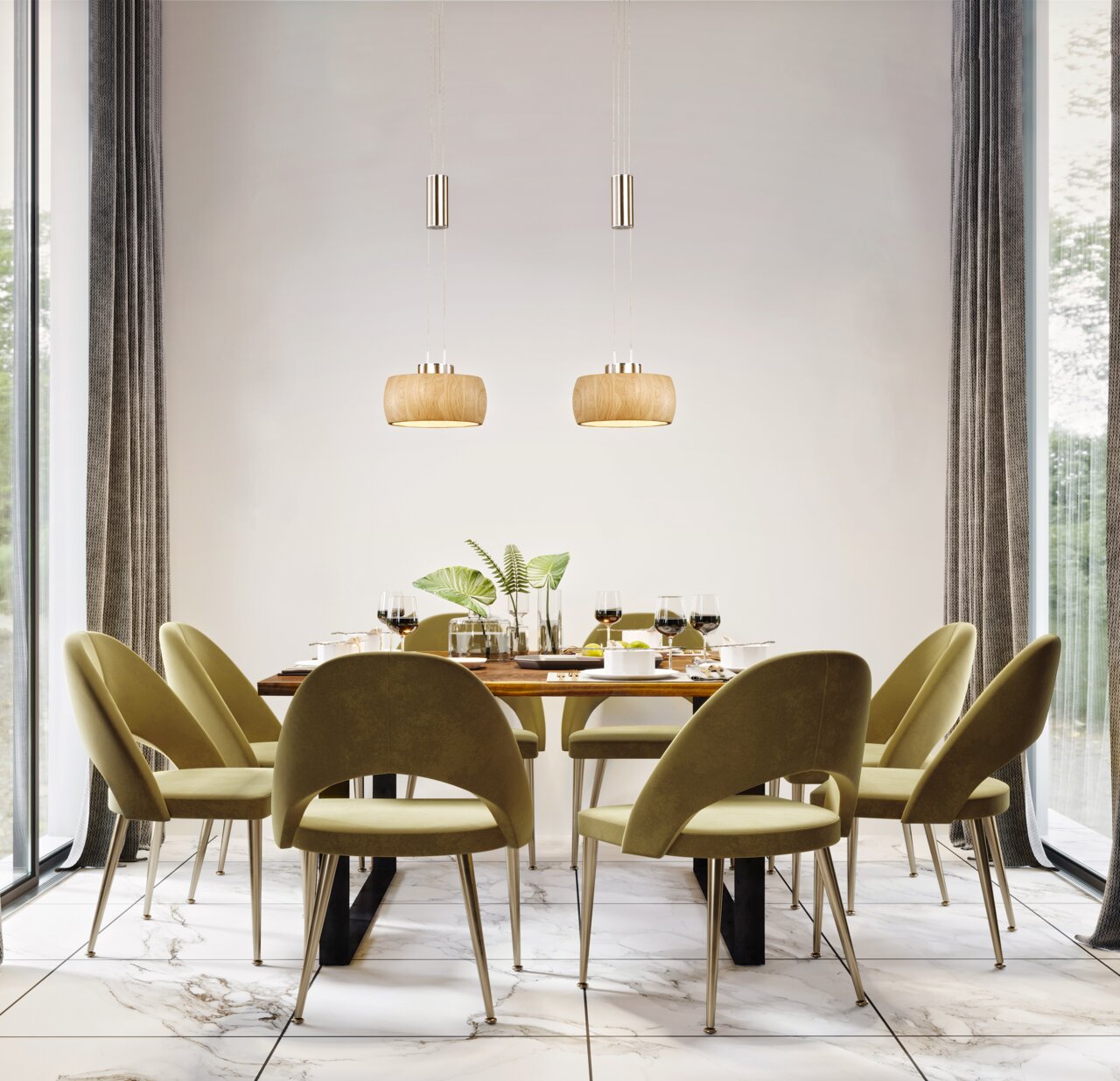 Moderne hanglamp boven een stijlvol gedekte eettafel met groene stoelen, zijaanzicht.