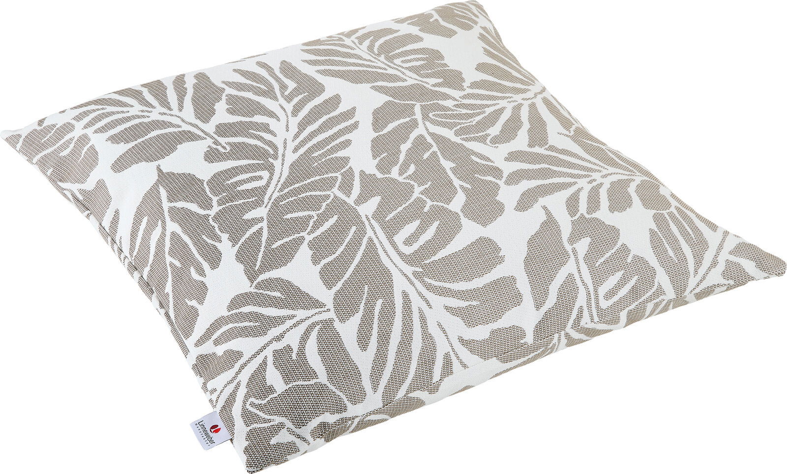 Outdoor Kissen mit Blätterdesign in Beige und Weiß, schräg von oben fotografiert