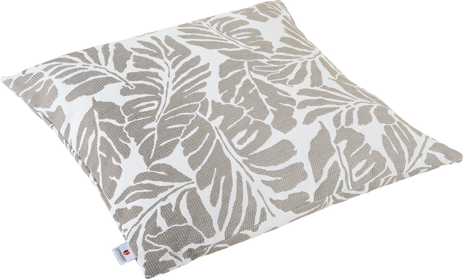 Outdoor Kissen mit Blätterdesign in Beige und Weiß, schräg von oben fotografiert