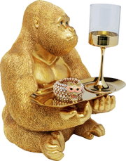 Goldene Gorilla-Dekofigur in Butler-Pose, die ein Tablett mit einem verzierten Glas und einem funkelnden Armband hält, seitliche Perspektive.