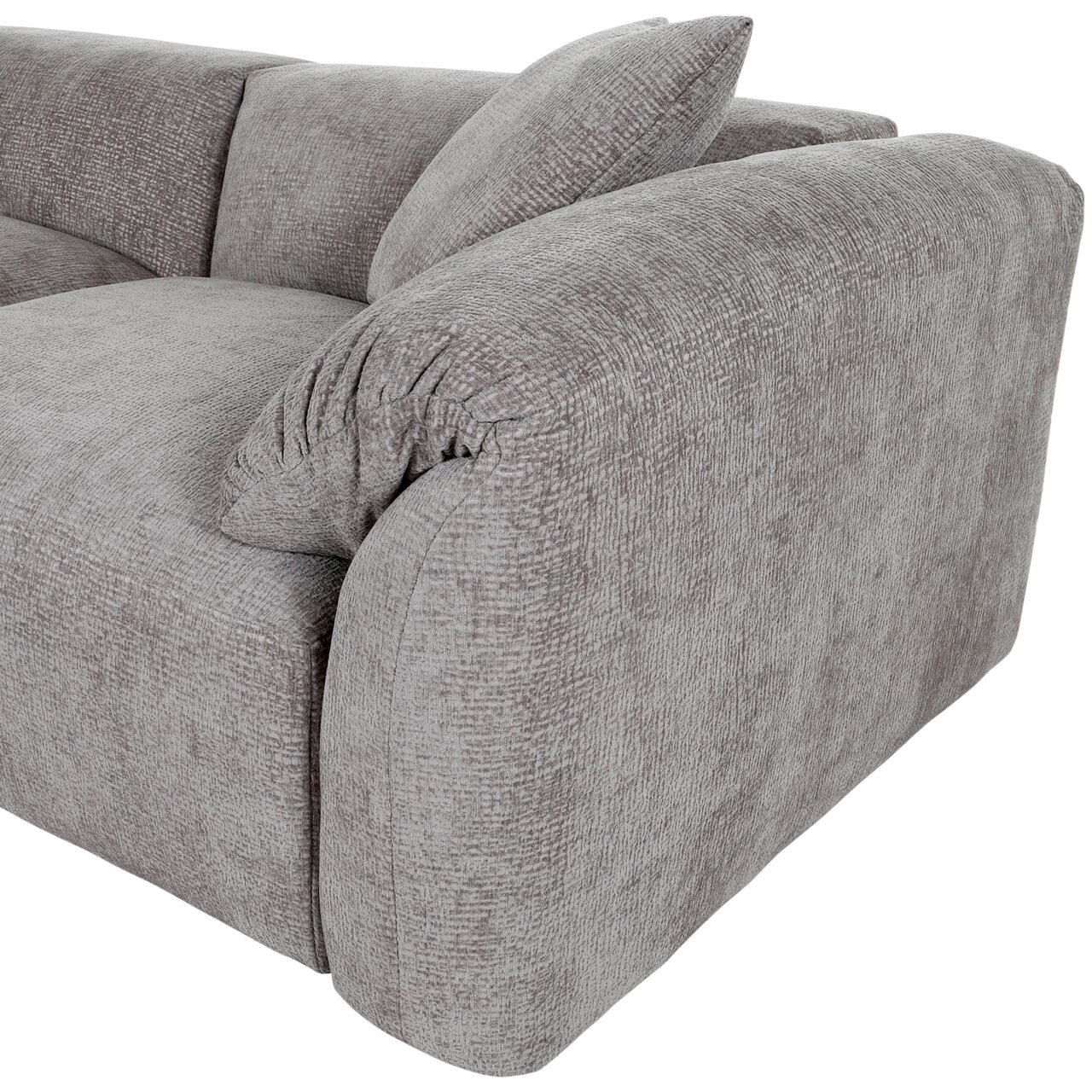 Graues Sofa mit abgerundeten Ecken und Kissen, seitliche Perspektive