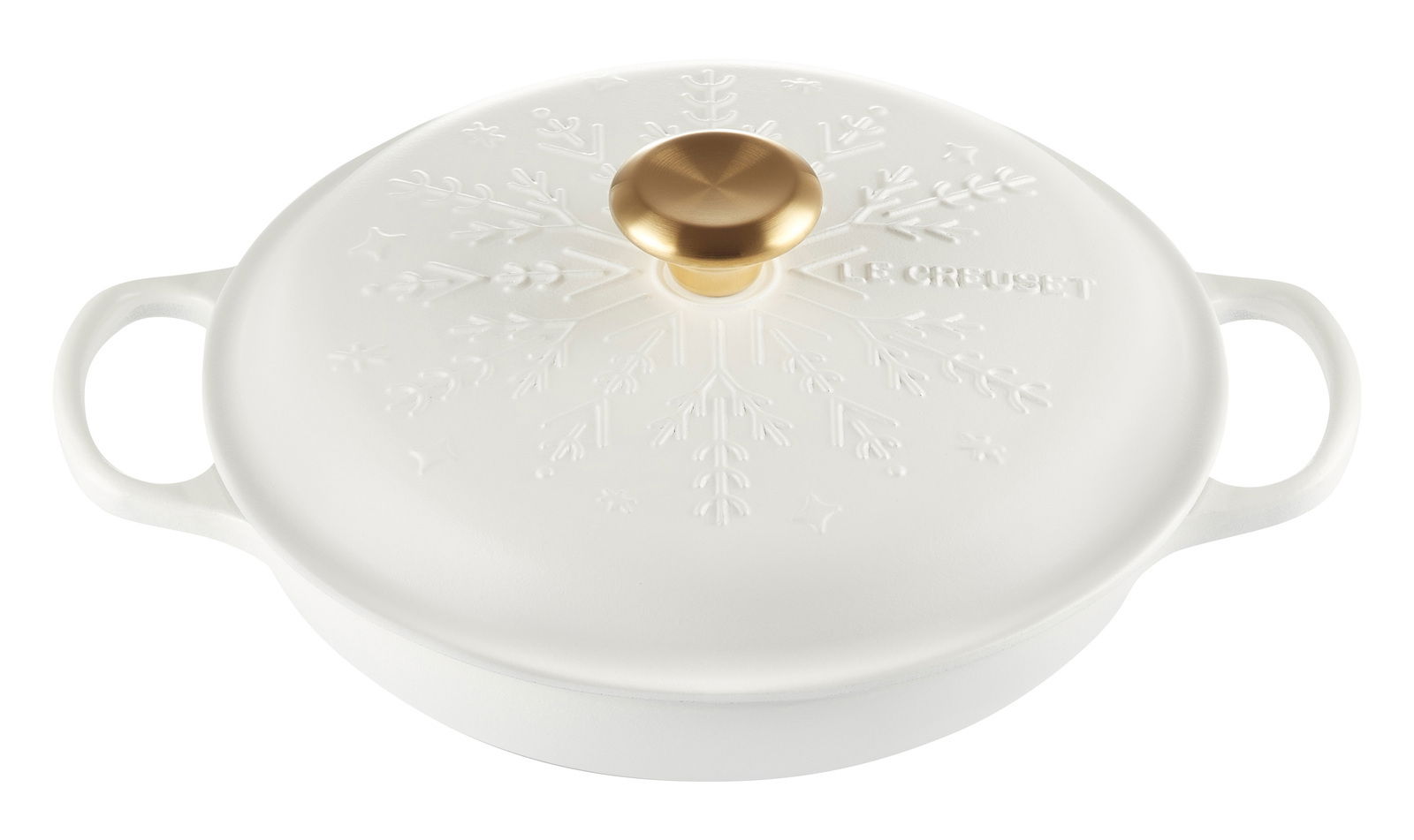 Weißer Gourmet-Topf mit Schneeflocken-Design und goldfarbenem Knauf, aus der Vogelperspektive.