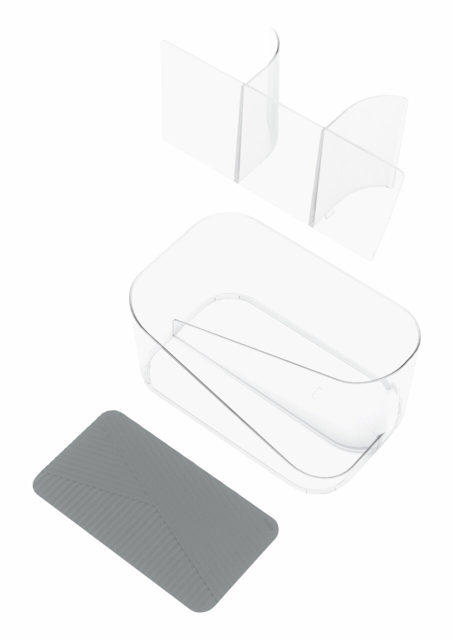 Doorzichtige opbergbak voor haaraccessoires met meerdere vakken en een grijze, antislipmat, gezien vanuit vogelperspectief.