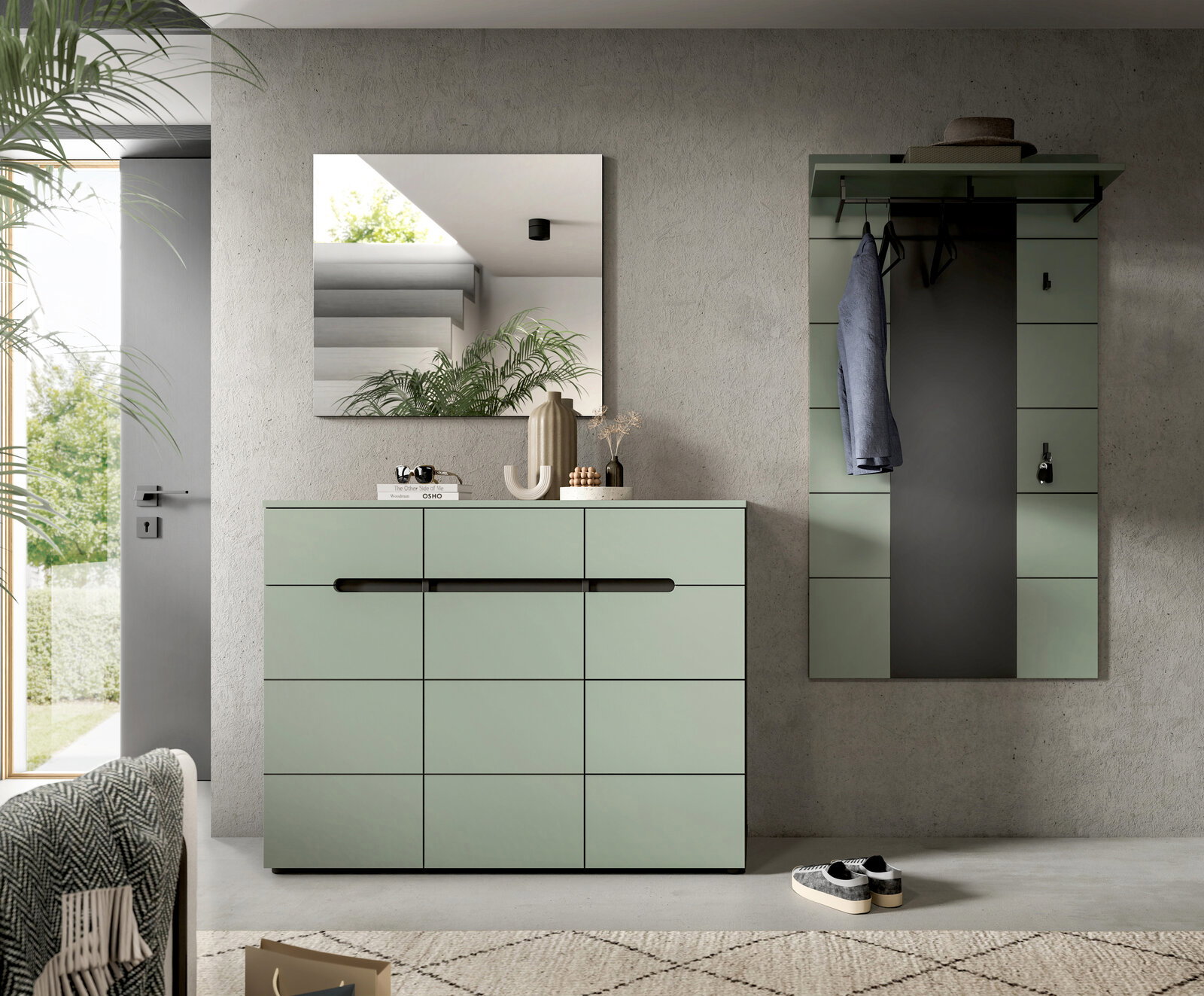 Modernes Flur-Set in Salbeigrün mit Kommode und Wandgarderobe samt Spiegel, frontal aus Augenhöhe fotografiert.