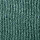 Nahaufnahme eines grünen, gerippten Stoffes, der für einen Hocker verwendet wird.