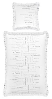 Bettwäsche-Set mit Kissen und Decke, bedruckt mit 'Ich liebe dich' in verschiedenen Sprachen, von oben betrachtet