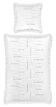 Bettwäsche-Set mit Kissen und Decke, bedruckt mit 'Ich liebe dich' in verschiedenen Sprachen, von oben betrachtet