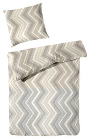 Bettwäsche-Set mit Zickzackmuster in Beige- und Grautönen, bestehend aus einem Kissenbezug und einem Bettdeckenbezug, aus der Vogelperspektive fotografiert.