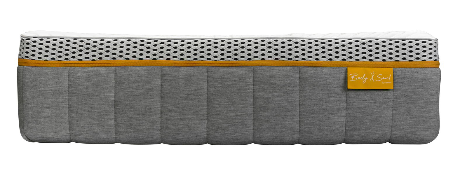 Seitenansicht einer grauen Matratze mit weißem und gelbem Akzent, Modell BODY&SOUL von irisette.
