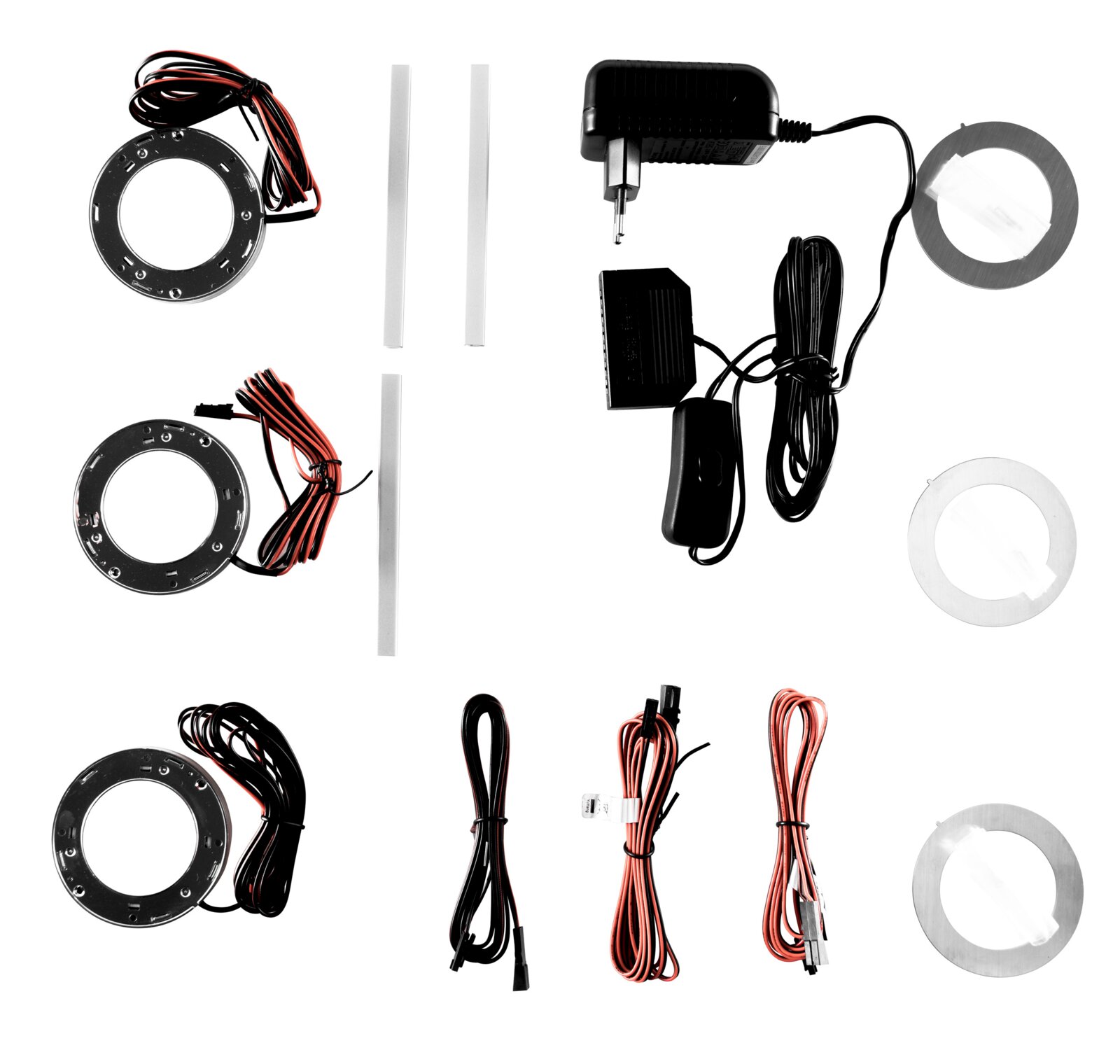 LED-Unterbauleuchten-Set mit runden Montageplatten, Anschlusskabeln, Netzteil und Schalter, Draufsicht (Flatlay) auf weißem Hintergrund