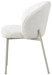 Seitenansicht eines weißen Armlehnstuhls mit modernem Design und Metallbeinen.