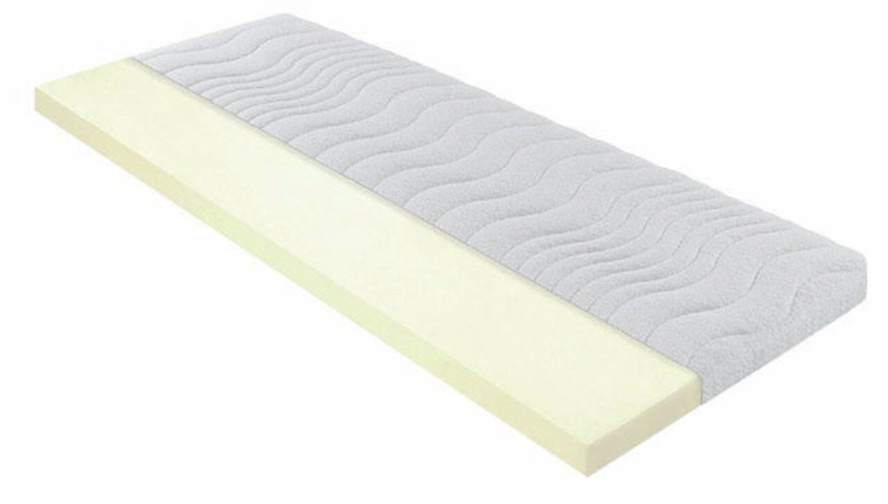 Seitliche Ansicht eines Topper Dream Deluxe VS mit wellenförmigem, grauem Bezug und cremefarbener Schaumstoffschicht.