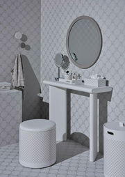 Ein stilvoll eingerichtetes Badezimmer mit einem runden Spiegel, einem weißen Hocker und einem weißen Porzellanbecher auf einem Waschtisch, seitliche Perspektive.