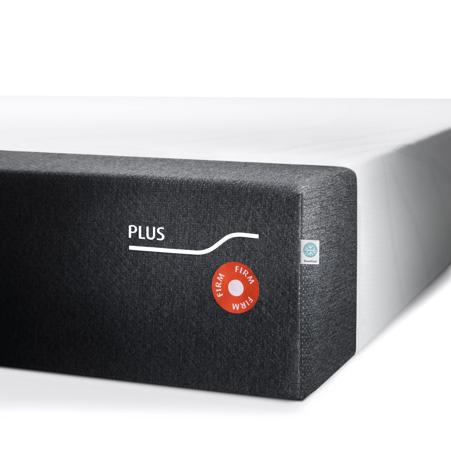Tempur Viscomatratze 120x200 firm FORM PLUS FIRM Ecke einer Viscomatratze mit grauem Bezug und Aufschrift 'PLUS' sowie 'FIRM' Siegel, seitliche Perspektive