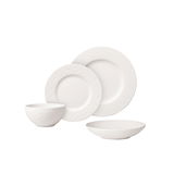 Weißes Tafelservice 16-teilig, bestehend aus Schüsseln und Tellern mit strukturierter Oberfläche, seitliche Perspektive