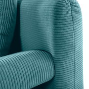 Nahaufnahme eines türkisfarbenen Funktionssofas mit geripptem Stoffbezug, Perspektive von der Seite