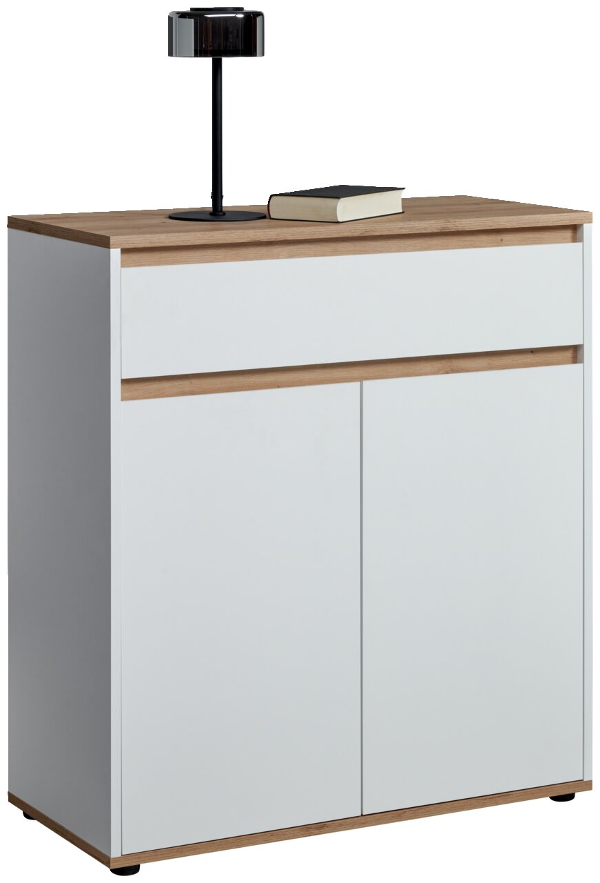 Moderne weiße Kommode mit Holzdetails, frontal abgebildet, mit einer Lampe und einem Buch auf der Oberseite.