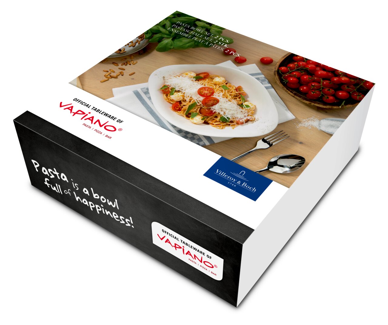 Verpakking van de 2-delige pastaschaal-set Vapiano van Villeroy & Boch, met een afbeelding van pasta in een schaal, omringd door verse tomaten en bestek, gezien vanuit een schuin vogelperspectief.