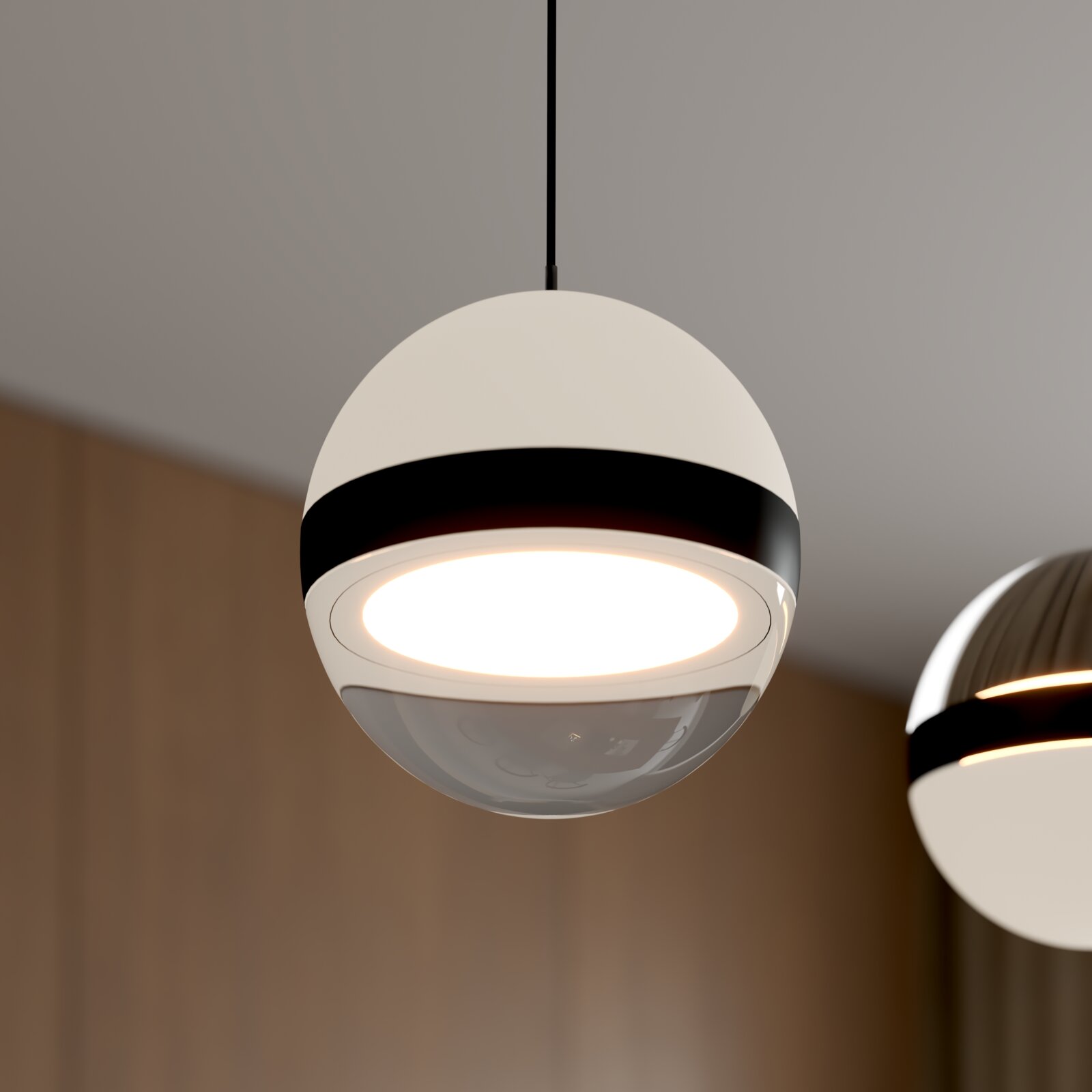 Moderne kugelförmige Pendelleuchte in Weiß mit schwarzem Ring und warmweiß leuchtender LED, Nahaufnahme in leichter Untersicht (von unten)