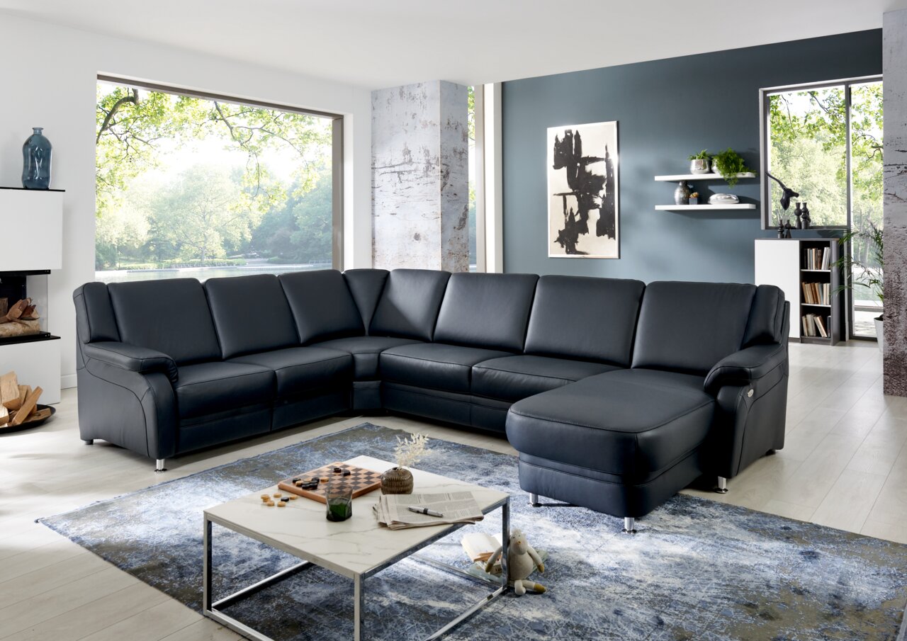 Ecksofa TAULON in einem modernen Wohnzimmer, Perspektive von vorne links