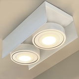 Moderne LED Aufbauleuchte mit zwei runden Lichtquellen, von unten betrachtet.