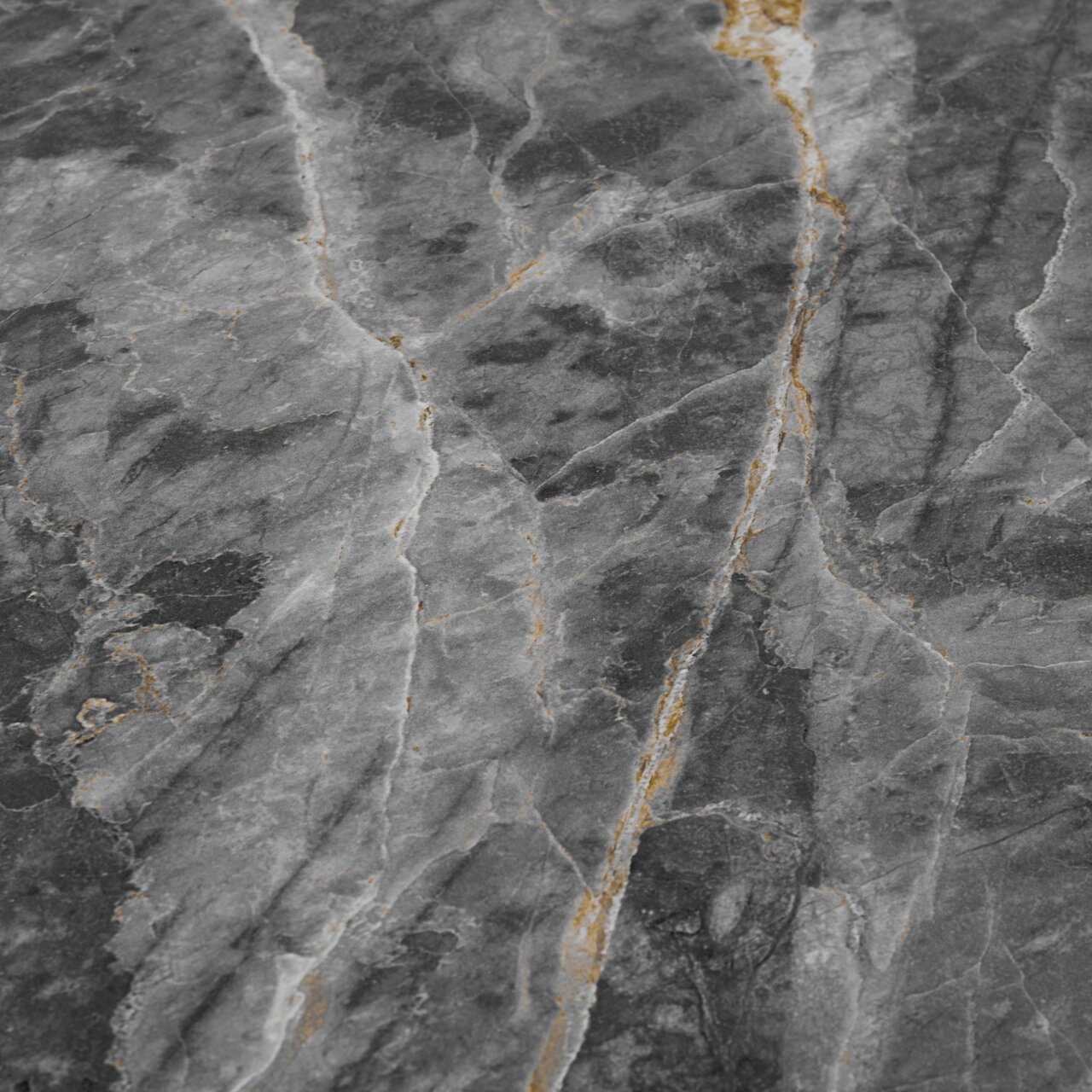 Nahaufnahme einer Tischplatte aus grauem Marmor mit goldenen Adern, von oben betrachtet.