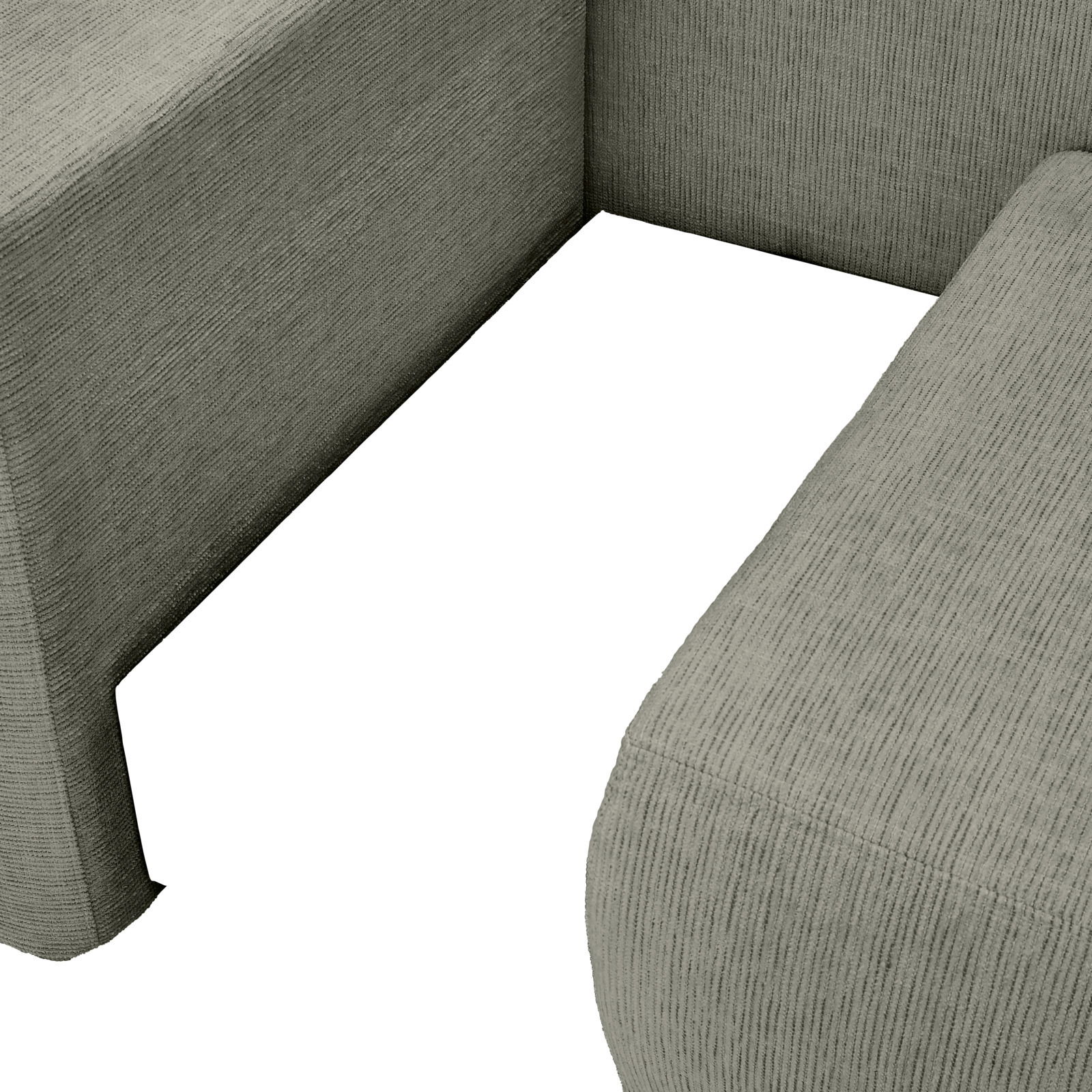 Nahaufnahme einer Recamiere in grauem Stoff, Perspektive von oben auf die Sitzfläche und Armlehne.