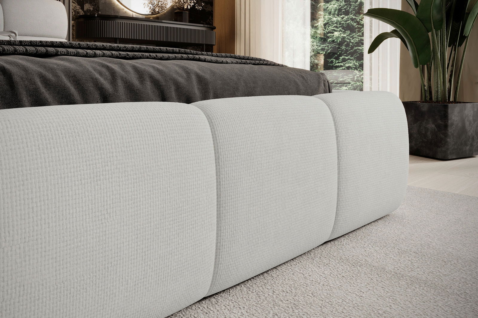 Nahaufnahme eines modernen Polsterbettgestells in einem eleganten Schlafzimmer, seitliche Perspektive.